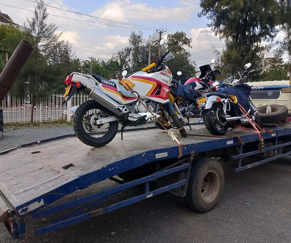 Professional flatbed towing service in Kenya transporting vehicle
